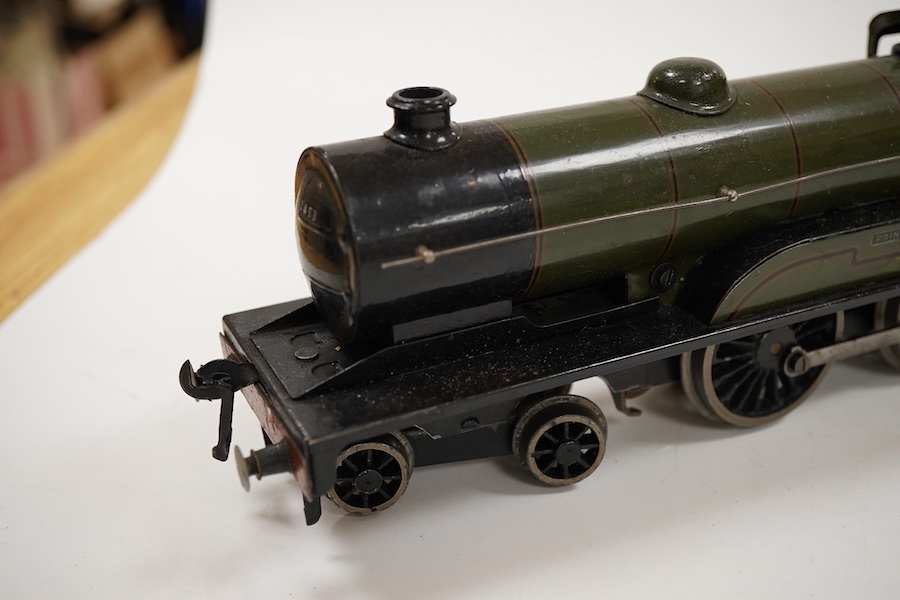 An 0 gauge Bassett-Lowke clockwork tinplate BR 4-4-0 tender locomotive, Prince Charles 62453, in dark green livery with orange and black lining and original clockwork mechanism